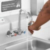 Regency Wall Mount Handsink Faucet With 3 1/2" Swivel Gooseneck Spout, 4" Centers, And Wrist Handles